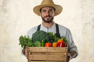 蔬菜农夫抱着一筐蔬菜食物摄影图