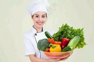 女生厨师抱着蔬菜盆生鲜白色背景摄影图