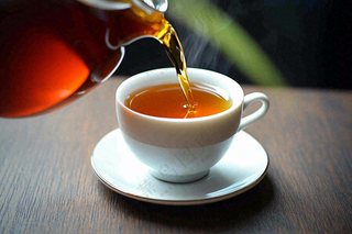 茶叶倒茶茶壶茶杯红茶摄影图