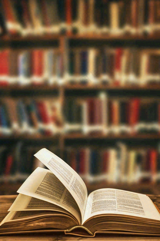 图书馆翻开的书本知识阅读教师节摄影图