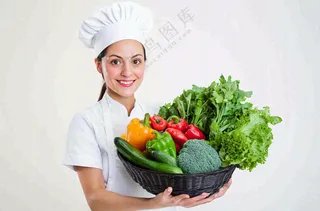 女生厨师抱着蔬菜盆生鲜白色背景摄影图