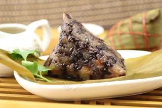 黑糯米粽子照片图片包粽子粽子摄影裹粽籺粽子摄影端午节