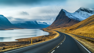 雪山下的公路湖泊河流高山摄影图