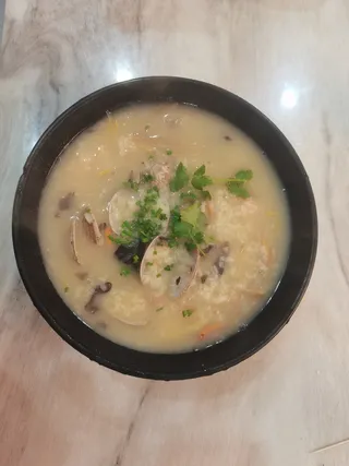 潮汕海鲜粥花甲大虾大闸蟹粥菜品菜谱实拍图片