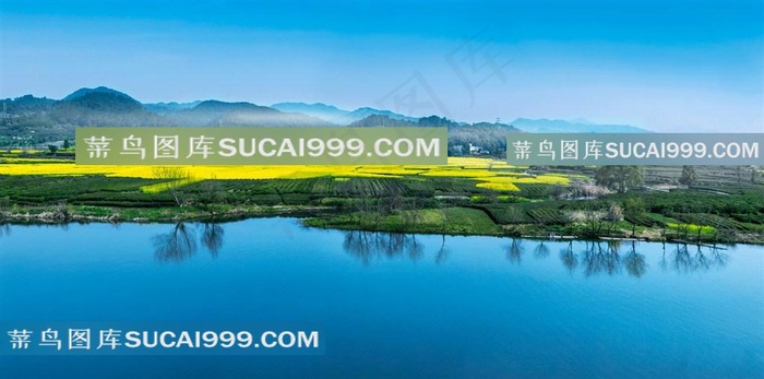 绿草乡村矮房远山摄影图