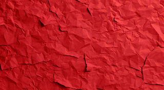 红色褶皱纸张纹理背景