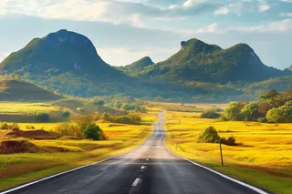 丘陵平原山林的公路摄影图