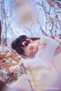 户外梅花林里的古装美女摄影图片