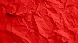 红色褶皱纸张纹理背景