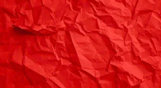 红色褶皱纸张纹理背景