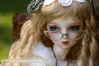 可爱的少女玩偶戴眼镜的金发女孩素材