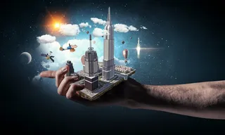 手掌上的城市建筑模块高清图片