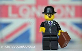 可爱的乐高玩具提包戴帽的小人素材