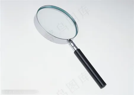 斜着摆放的放大镜特写 斜着摆放的放大镜特写