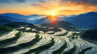 日落时的中国农村梯田鸟瞰摄影图