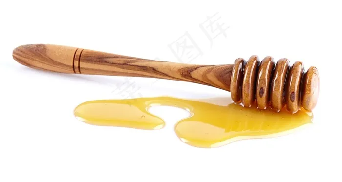 白色背景上流淌的蜂蜜和蜂蜜棒高清图片
