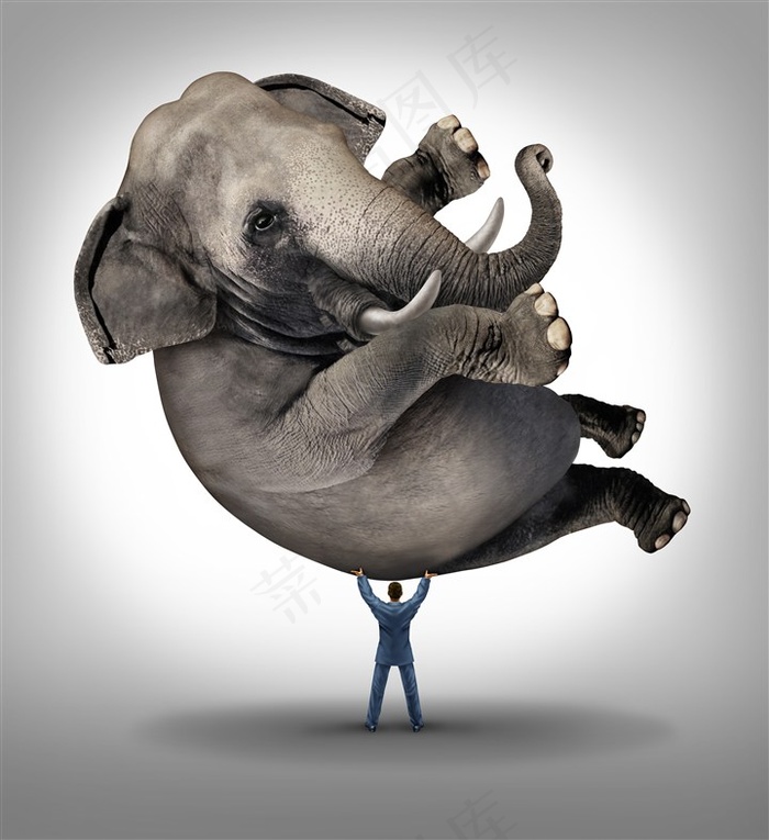 举起大象的男人创意高清图片