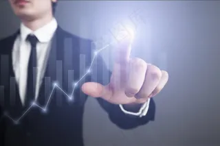 点击发光曲线图顶端的商务人士高清图片