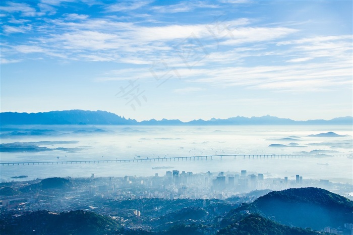 蓝色现代城市建筑山峰云海远景