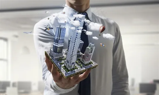 穿着衬衫的男士和手上的城市建筑模块高清图片