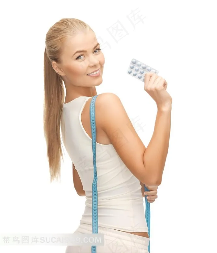手拿着减肥胶囊的美女人物摄影高清图片