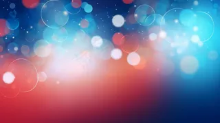 闪光抽象灯彩色的灰尘和光芒豪华散景背景