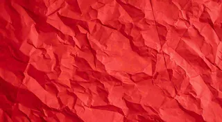 红色褶皱纸张纹理背景