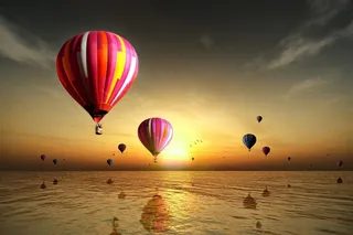 海上晚霞热气球美丽景色风景图片