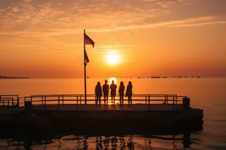 夕阳海边落日余晖摄影图