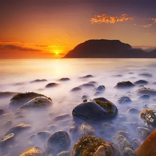 唯美高清傍晚海边礁石风景图片