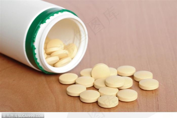 医学药品-倒出的淡黄色药片