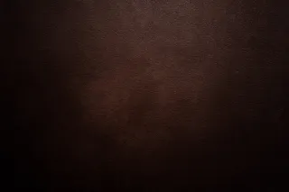 黑棕色牛皮纹理背景高清图片