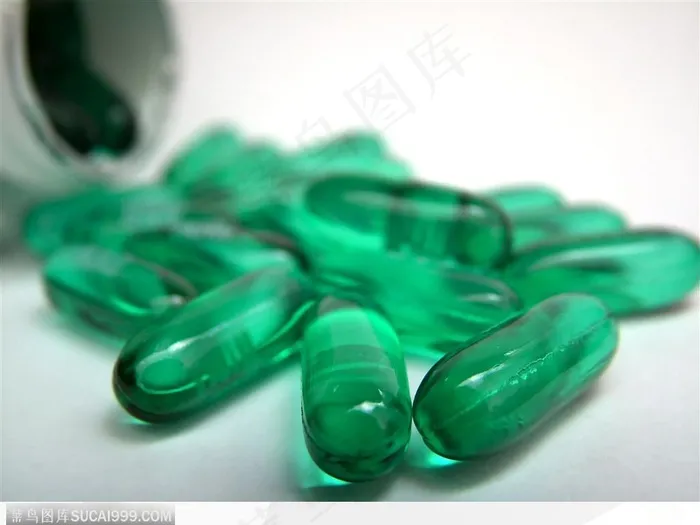 医学药品-散落的蓝色胶囊