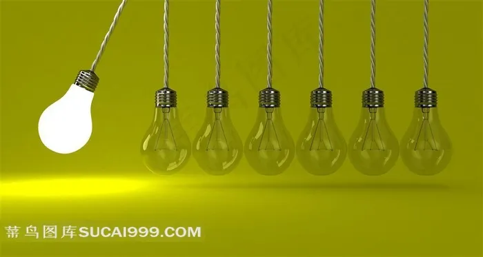 绿色背景前挂着的灯泡创意摄影高清图片