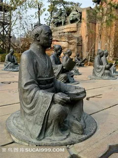 拿着书本坐着的古代男子雕塑