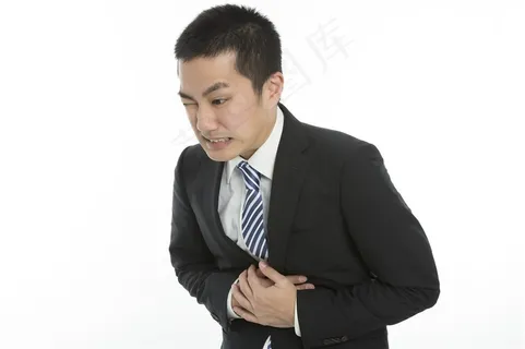 双手捂着胃部的商务人士高清图片 双手捂着胃部的商务人士高清图片