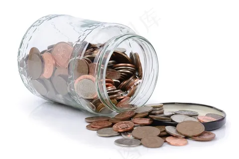 装满硬币的透明玻璃罐素材高清摄影图片