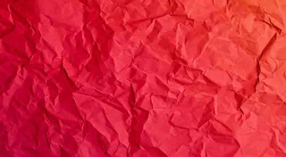 红色褶皱纸张纹理背景