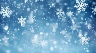 冬天雪花飘落白雪蓝色背景摄影图