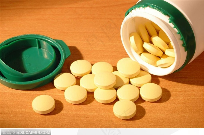 医学药品-桌上倒出的黄色药片