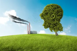 蓝天下的烟囱绿地和人形大树高清图片