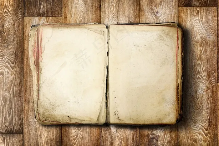 地板上的复古羊皮笔记本高清图