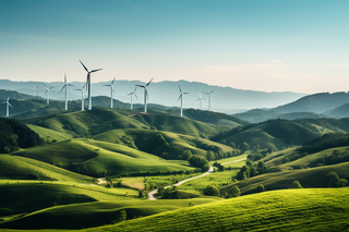 很多的风车新能源发电在绿色的山坡上摄影图