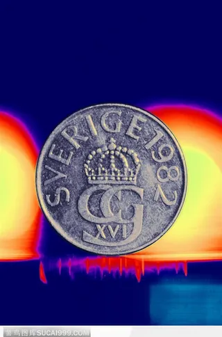 灯光下的单个硬币背景大图