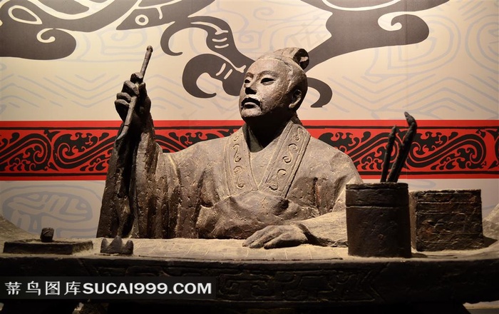 拿着笔的古代男子雕塑