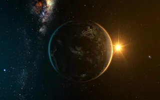 宇宙中的地球与升起的太阳