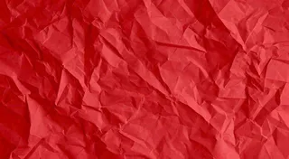 红色褶皱纸张纹理背景