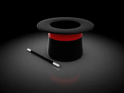 黑色魔术帽和魔术棒高清图片