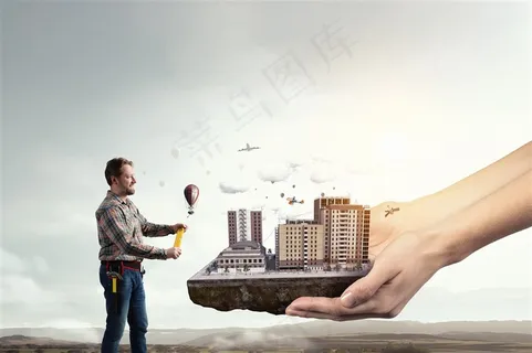 双手捧着的城市和正在放氢气球的男士高清图片