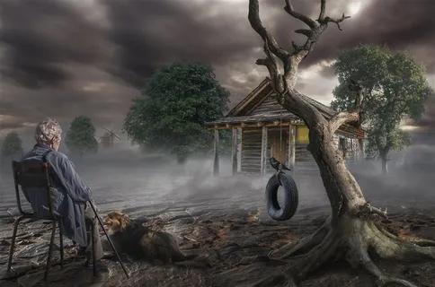 坐在贫瘠的大地上的老人和枯树木屋高清图片 坐在贫瘠的大地上的老人和枯树木屋高清图片